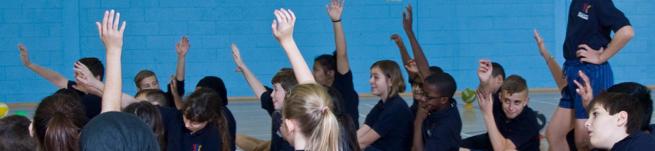 Children reaching into the sky